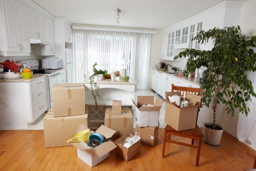 Packers carefully packing furniture for storage