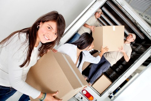 Customer loading items into a removal truck